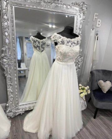 This is a picture of a beautiful wedding dress called Tessa which is available from Fairytale Bride